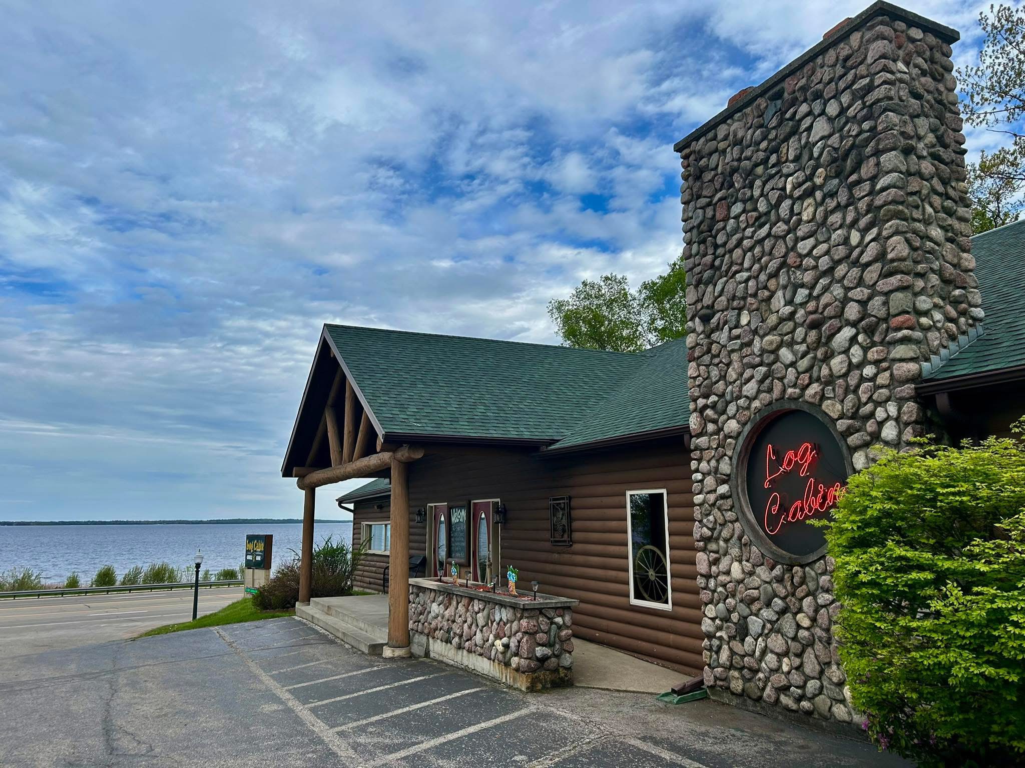 Log Cabin Grill and Bar exterior by the bay